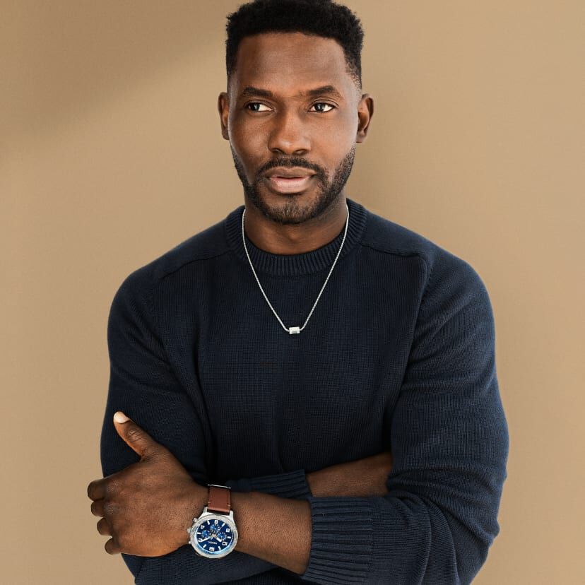 Man wearing jewelry.