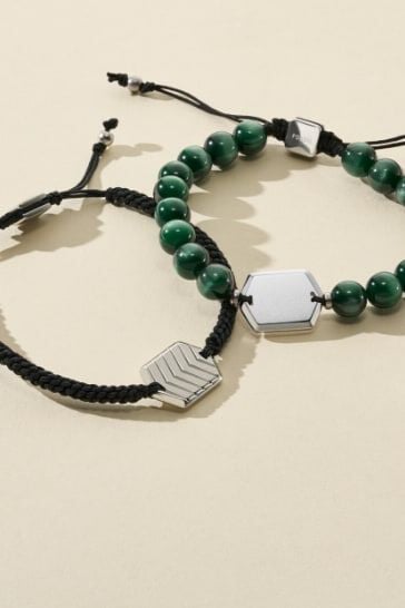 Two green beaded bracelets with silver accents.