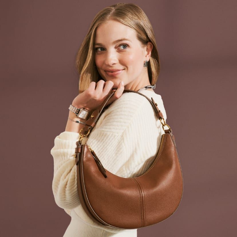 Woman wearing bag.