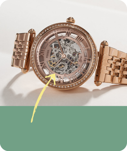 a mechanical watch with an arrow pointing to a highlighted item