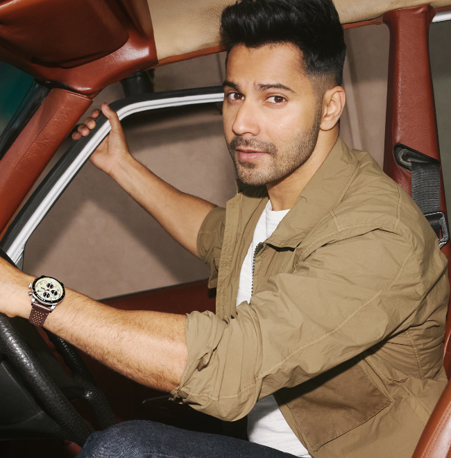 A man in a leather jacket wearing the brown leather Sport Tourer watch.