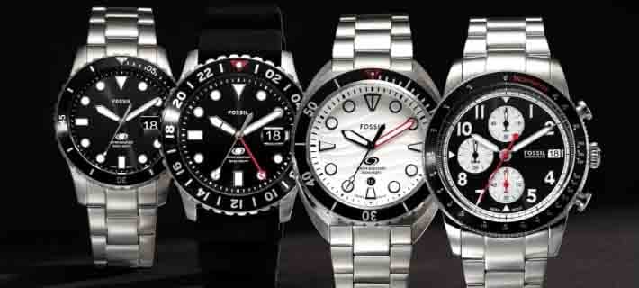 Four stainless steel sport watches.