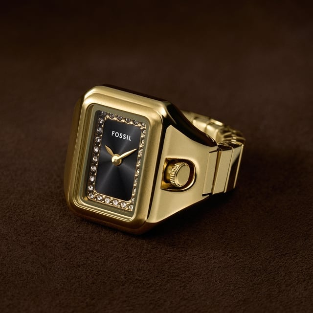 The Harlow watch ring, featuring a gold-tone finish and octagonal shaped case with a subtly patterned dial.