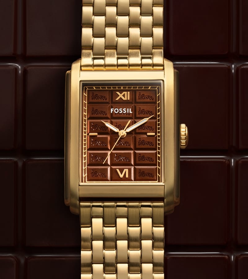 A brown chocolate bar-like background with a limited-edition gold-tone Carraway watch featuring a chocolate bar-inspired dial.