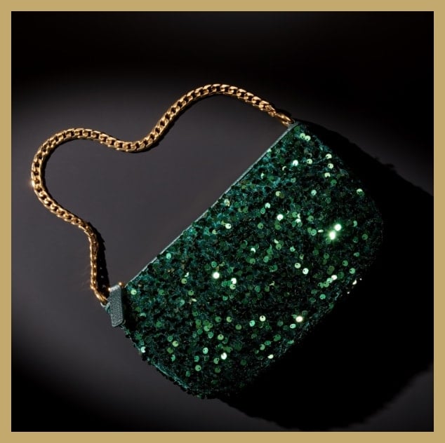 An emerald green sequin bag with a gold-tone chain strap.