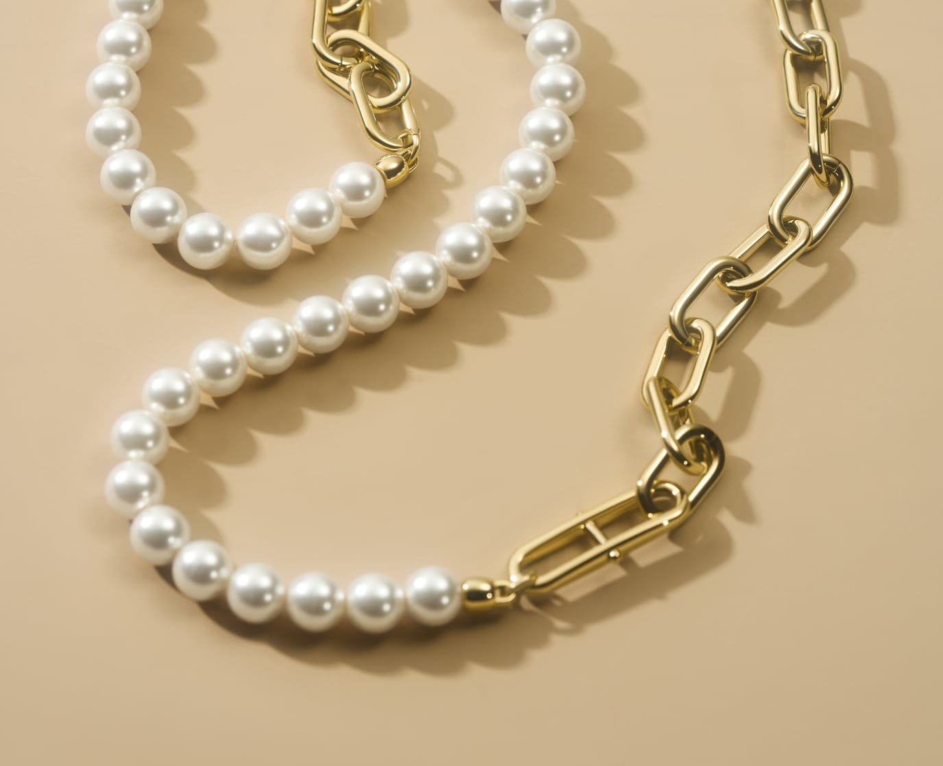 Gold-tone and imitation glass pearl Fossil Heritage jewellery.