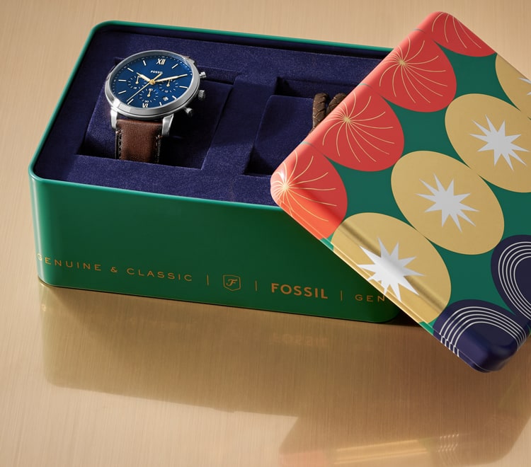 Gif of a brightly colored Fossil gift set tin opening to reveal a men's brown leather watch and brown leather bracelet.