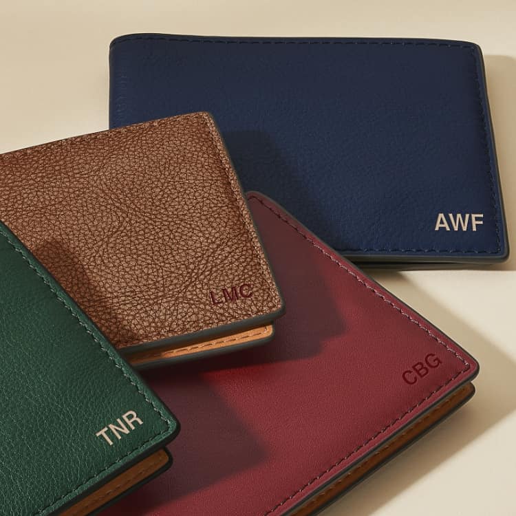 Four embossed men's wallets.