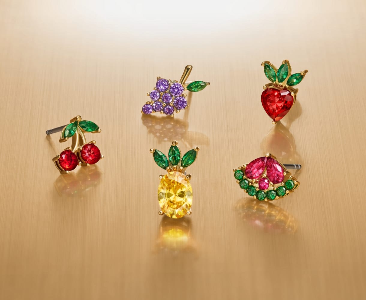 Five fruit-shaped crystal stud earrings. 