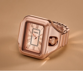 A rose gold-tone watch ring.