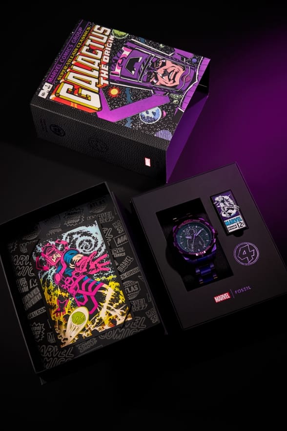 The open display box reveals the purple Galactus watch inside, as well as archival comic book art, a lapel pin of the Silver Surfer and the graphic number four, representing the Fantastic Four.