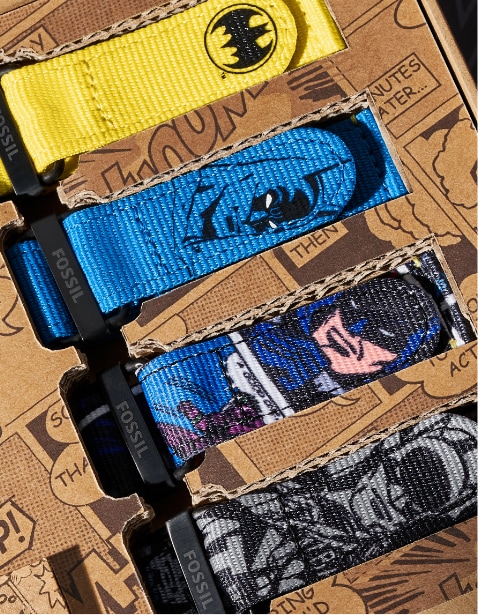 Quatre bracelets interchangeables colorés avec des illustrations Batman.