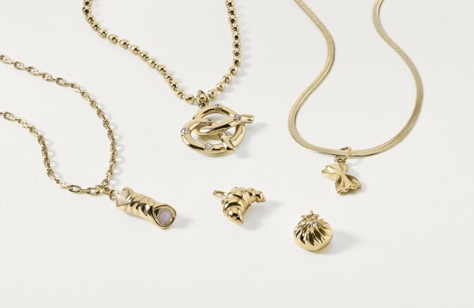 Gold-tone necklaces and charms. 