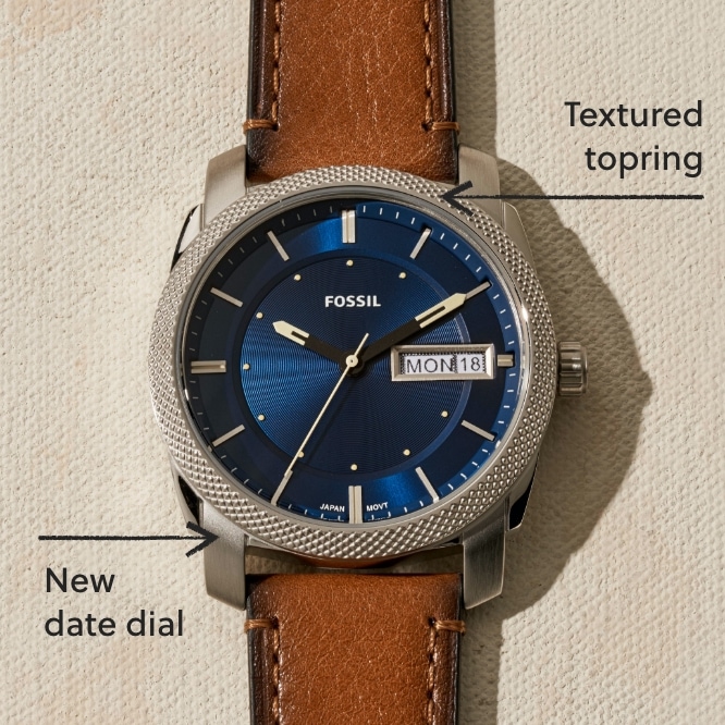 A brown leather Machine watch with a blue dial.