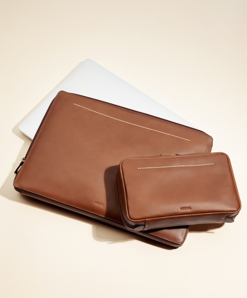 The brown leather Westover laptop sleeve and small shave kit.