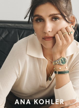 Ana Kohler is wearing various green and gold pieces of jewelry and the Scarlette Fossil watch in the same hues