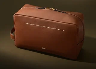 A tan leather travel kit.