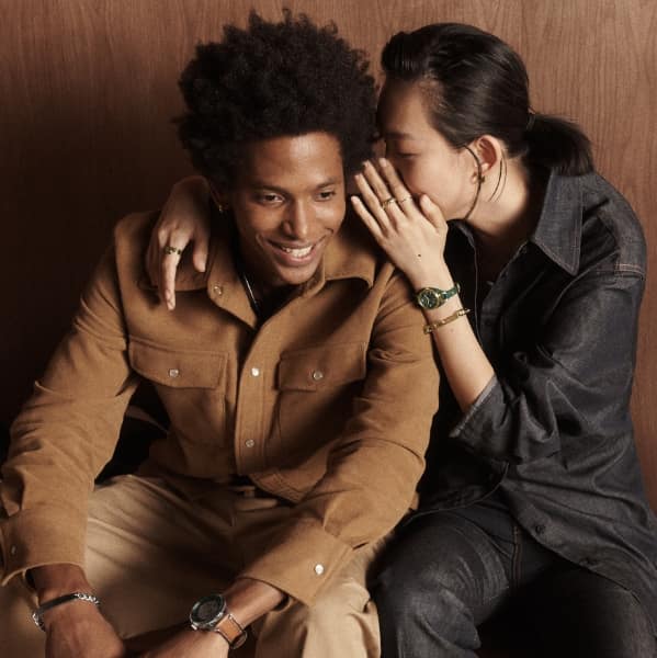 A woman and man smiling.