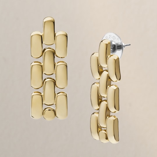 Gold-tone earrings.
