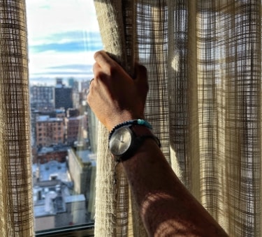 A man wearing the brown leather Machine watch.