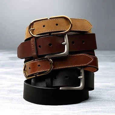 Stack of assorted leater belts.