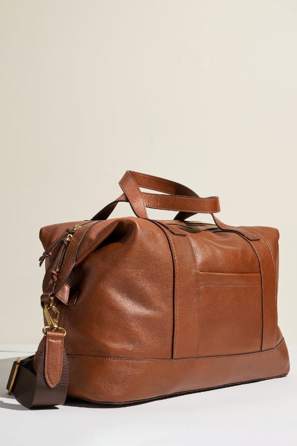 A brown leather Raeford duffle bag.