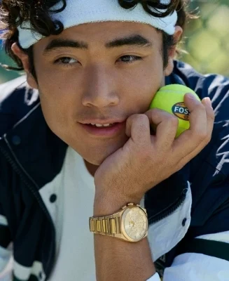 A man dressed in a blue button down shirt, wearing the Everett watch.