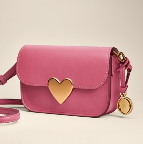 The pink leather Lennox handbag with heart-shaped closure.