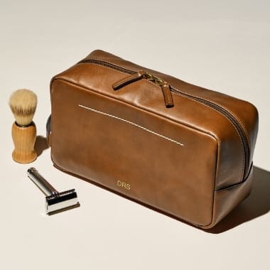 A brown leather shave kit.