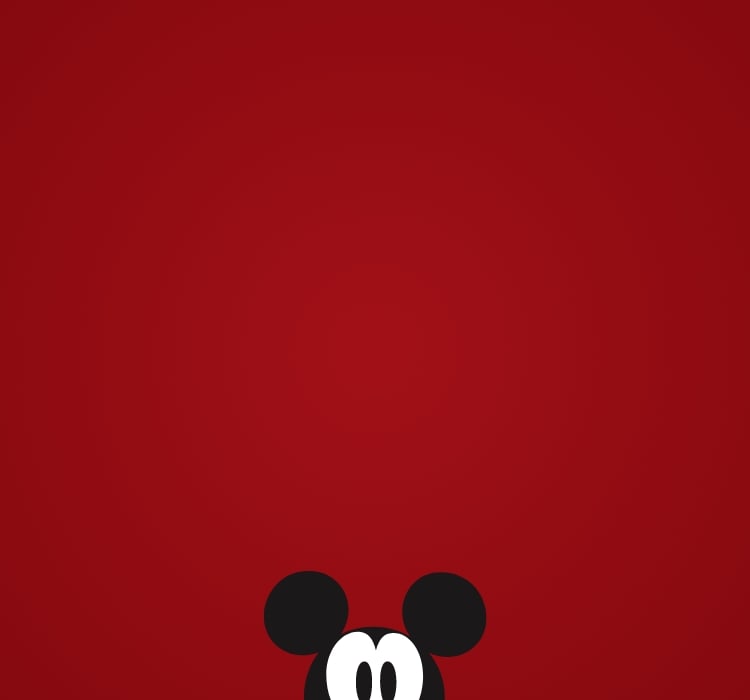 Grafica Disney x Fossil con la sagoma di Mickey Mouse che sbircia dalla parte inferiore della cornice.