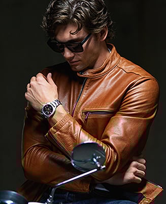 Lifestyle image of a man wearing a tan leather jacket, black sunglasses and the rugged Machine watch.