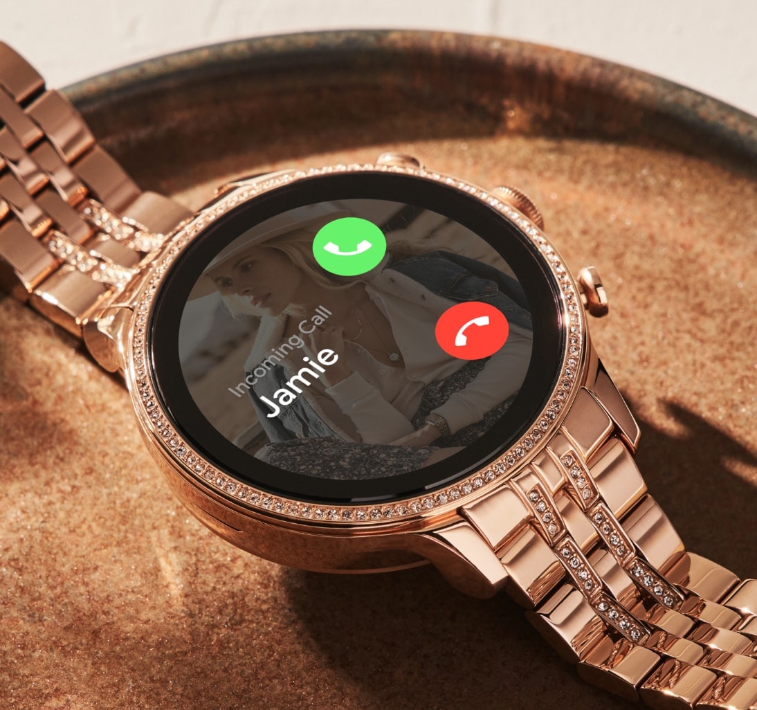 A rose gold-tone stainless steel Gen 6 smartwatch with incoming call on the dial.