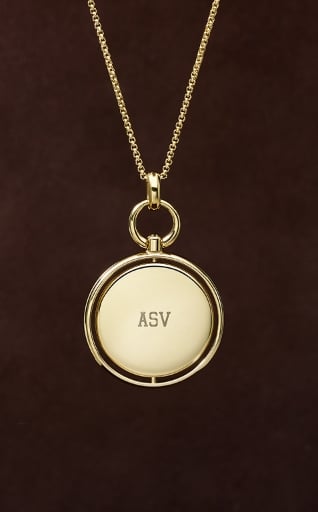 An engravable pendant necklace in a gold-tone finish.