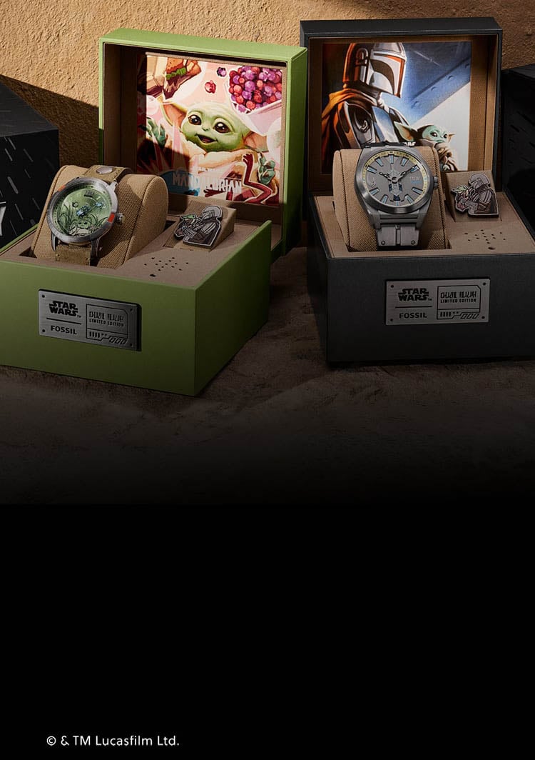 The Star Wars and Fossil Mandalorian collection, featuring the Fossil Limited-Edition Mandalorian and Grogu watches, along with their display packaging.