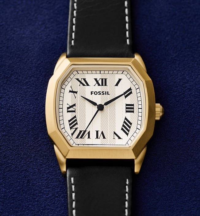 A close crop of the Fossil Harlow 33mm octagonal case in a gold-tone finish.