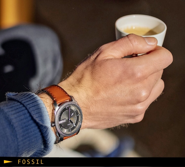 A man wearing the brown leather Machine watch.