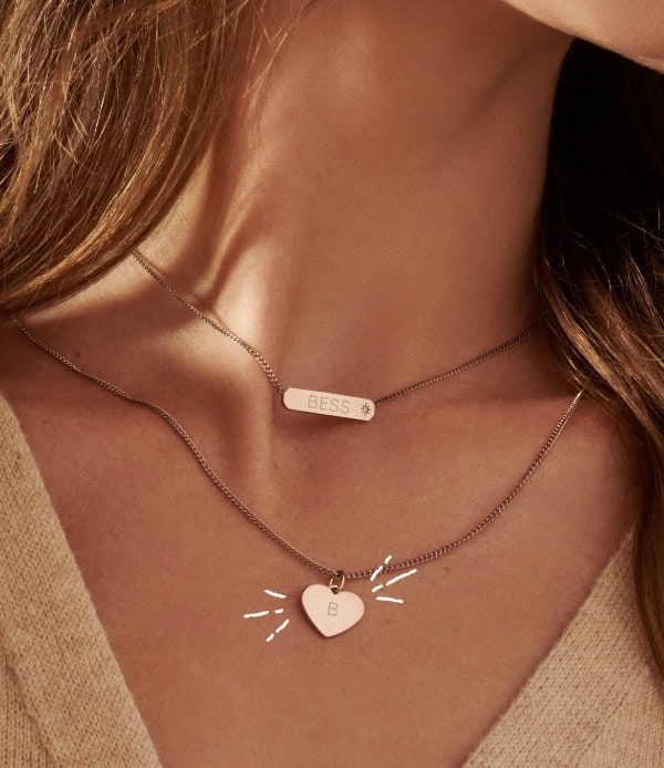 A rose gold-tone bar necklace and a rose gold-tone heart necklace