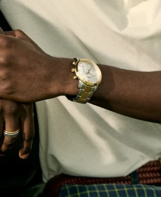 A man wearing a casual brown jacket and the Neutra watch.