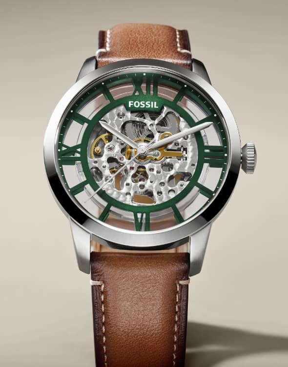 A closeup of the Townsman Automatic with a green skeleton dial.