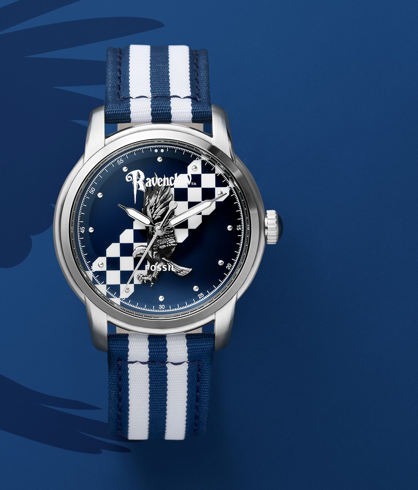 Montre dorée de la maison Serdaigle avec un bracelet bleu et blanc.