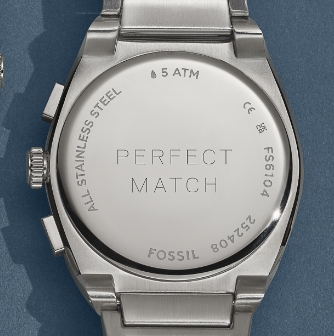 The engraved caseback on a silver-tone watch.