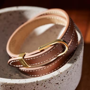 A brown leather bracelet.