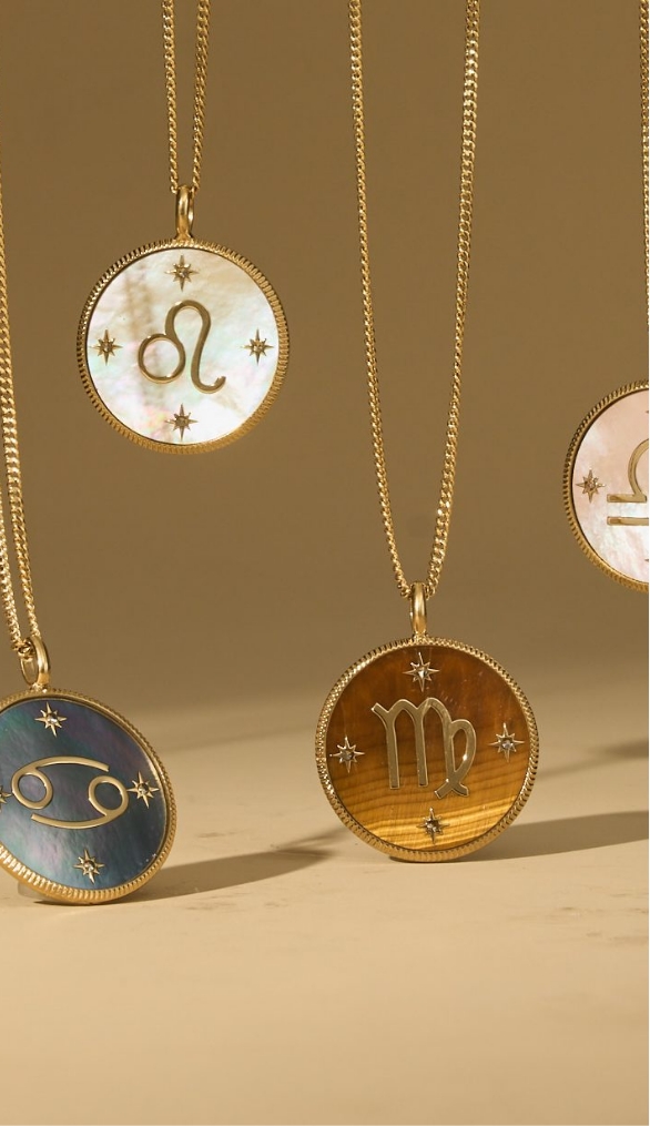Four Zodiac collection pendants.