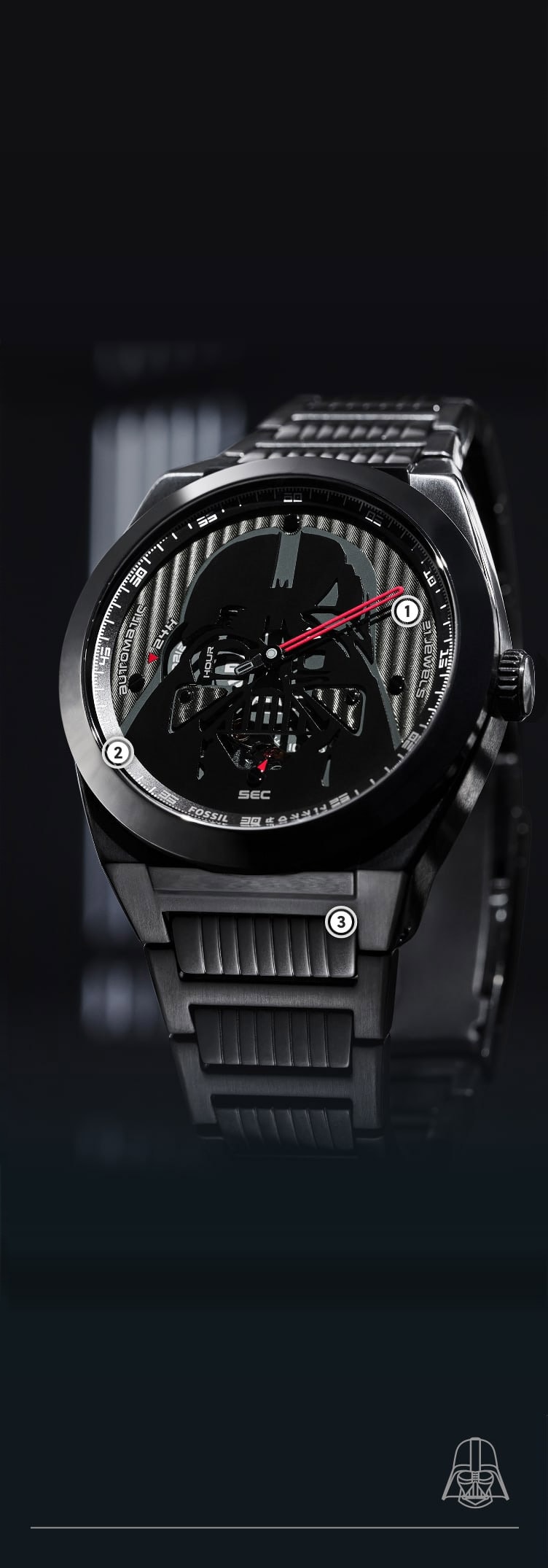 A close up shot of a black watch with a dimensional Darth Vader helmet on a textured black dial.