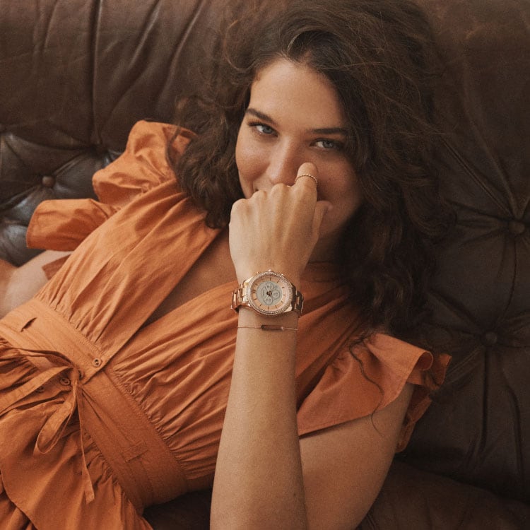 Image of female model wearing a Gen6 Hybrid watch.