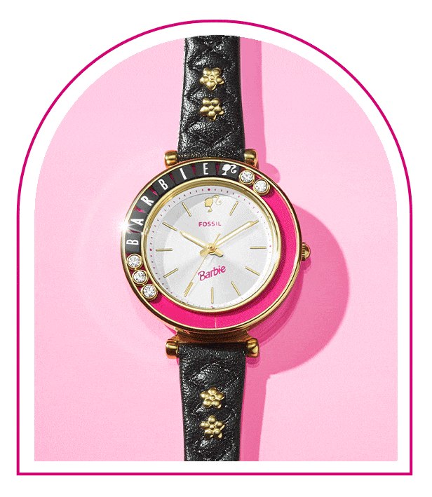 A pink background with a Barbie™ Mansion-inspired window. Inside the window sits our limited-edition Barbie™ x Fossil watch ring, featuring a gold-tone five-petal flower design, white dial with pink barbie logo and flexible band to fit any finger.