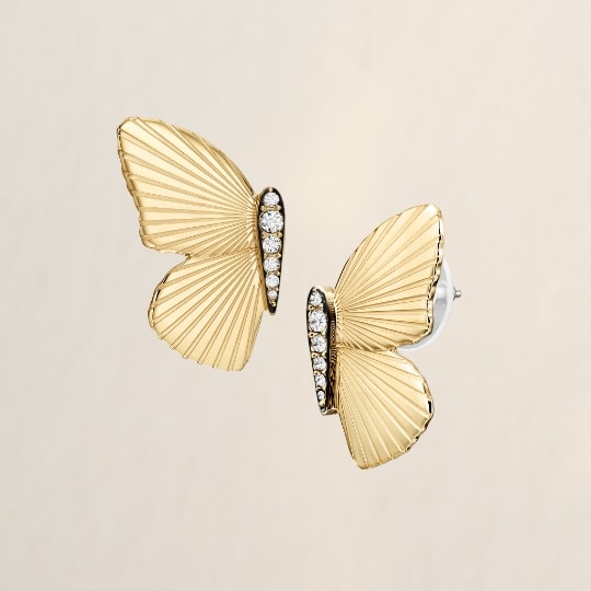 Gold-tone butterfly earrings with glitz.