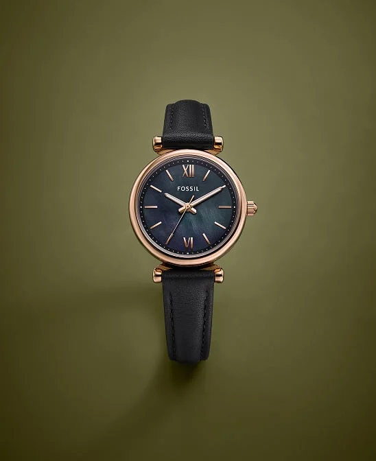 A women's Fossil watch featuring a black leather strap.