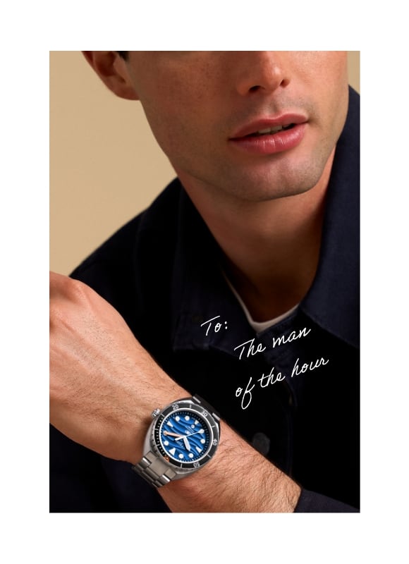A man wearing the stainless steel Breaker Dive watch with a blue dial. Handwritten Text - To: The man of the hour