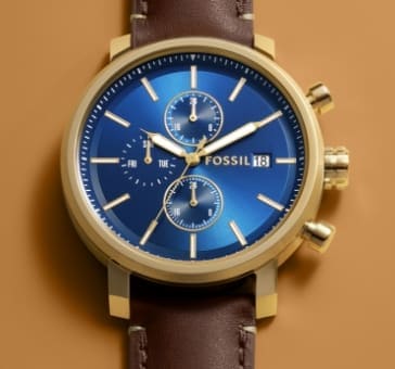 A men’s watch with a blue dial, oversized lugs and brown leather strap.